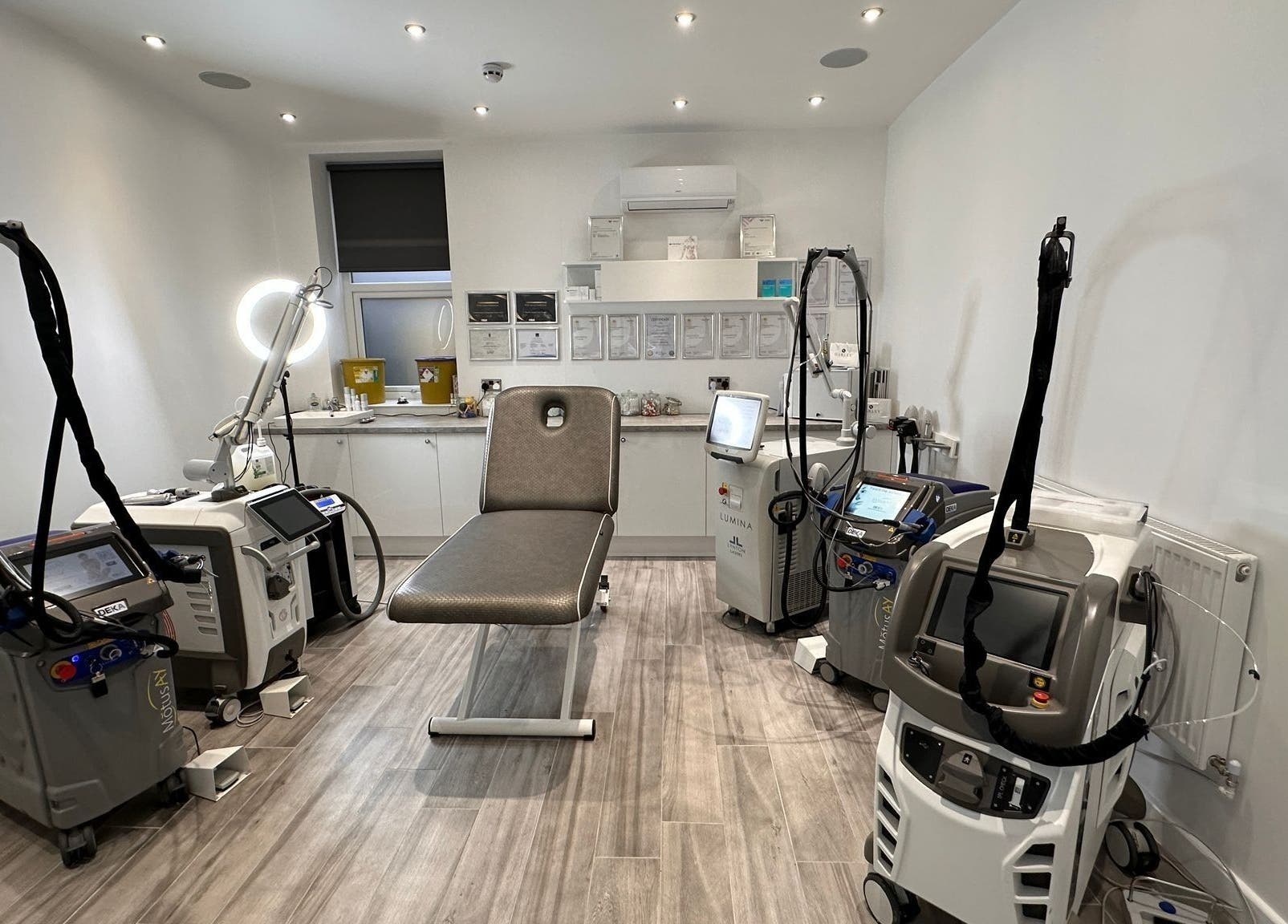 Modern laser treatment room at Harley Skin and Laser, Stoke-on-Trent, England, GB, featuring advanced equipment.