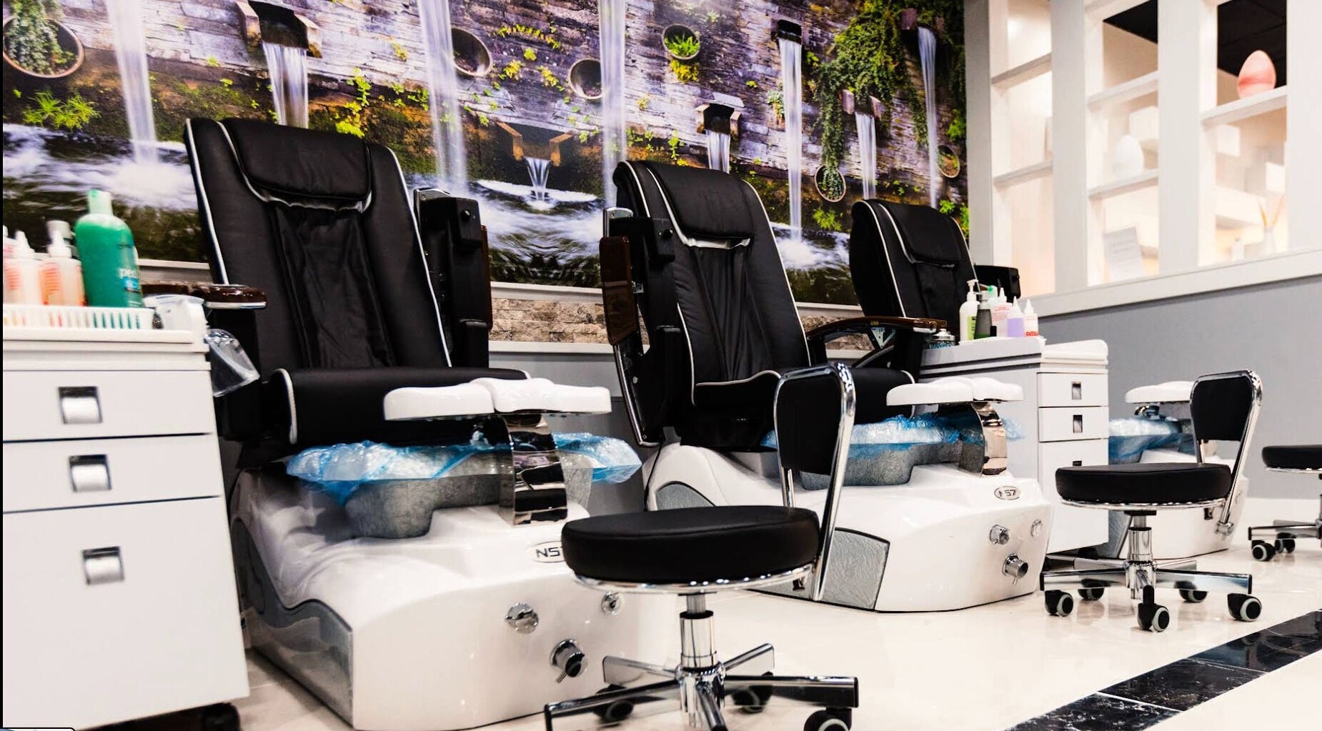 Elegant pedicure chairs at Vino Nail Bar, Malvern, Pennsylvania, US, offering relaxing spa experiences.