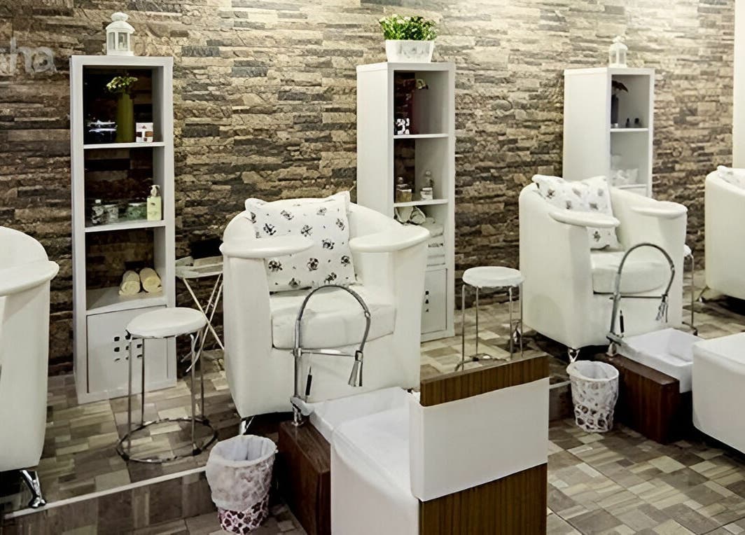 Relaxing pedicure area at Stella Beauty Salon, Dubai, Dubai, AE with plush seating and modern decor.