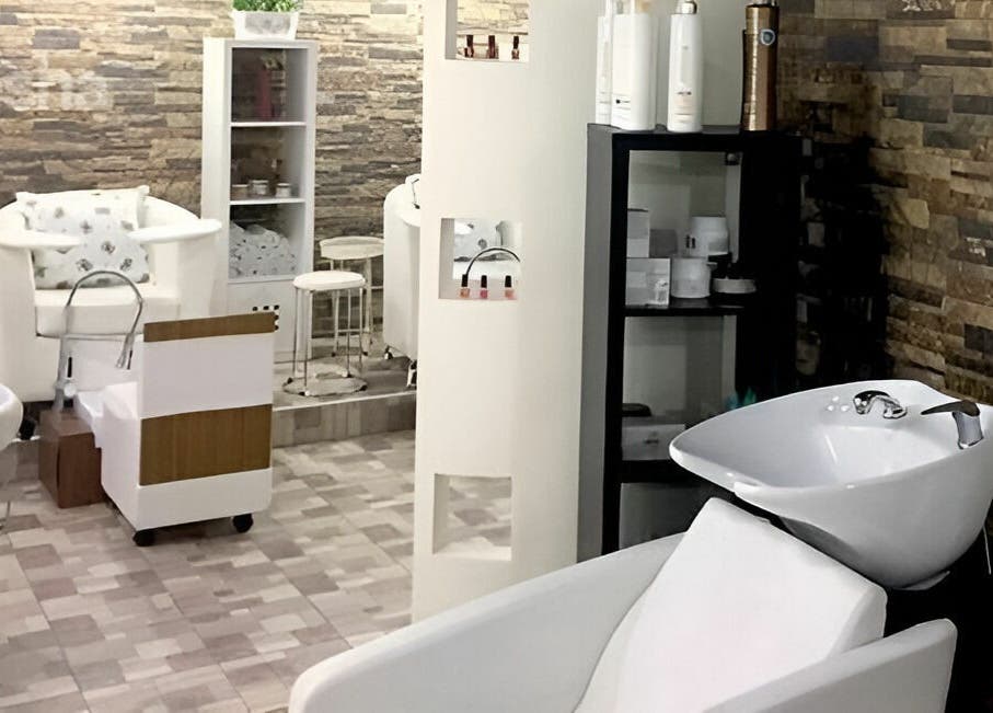 Elegant interior of Stella Beauty Salon in Dubai, Dubai, AE featuring modern salon chairs and lush decor.