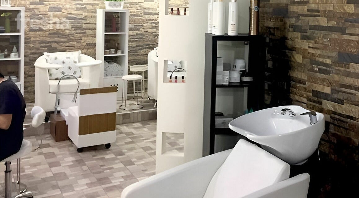 Elegant interior of Stella Beauty Salon in Dubai, Dubai, AE featuring modern salon chairs and lush decor.