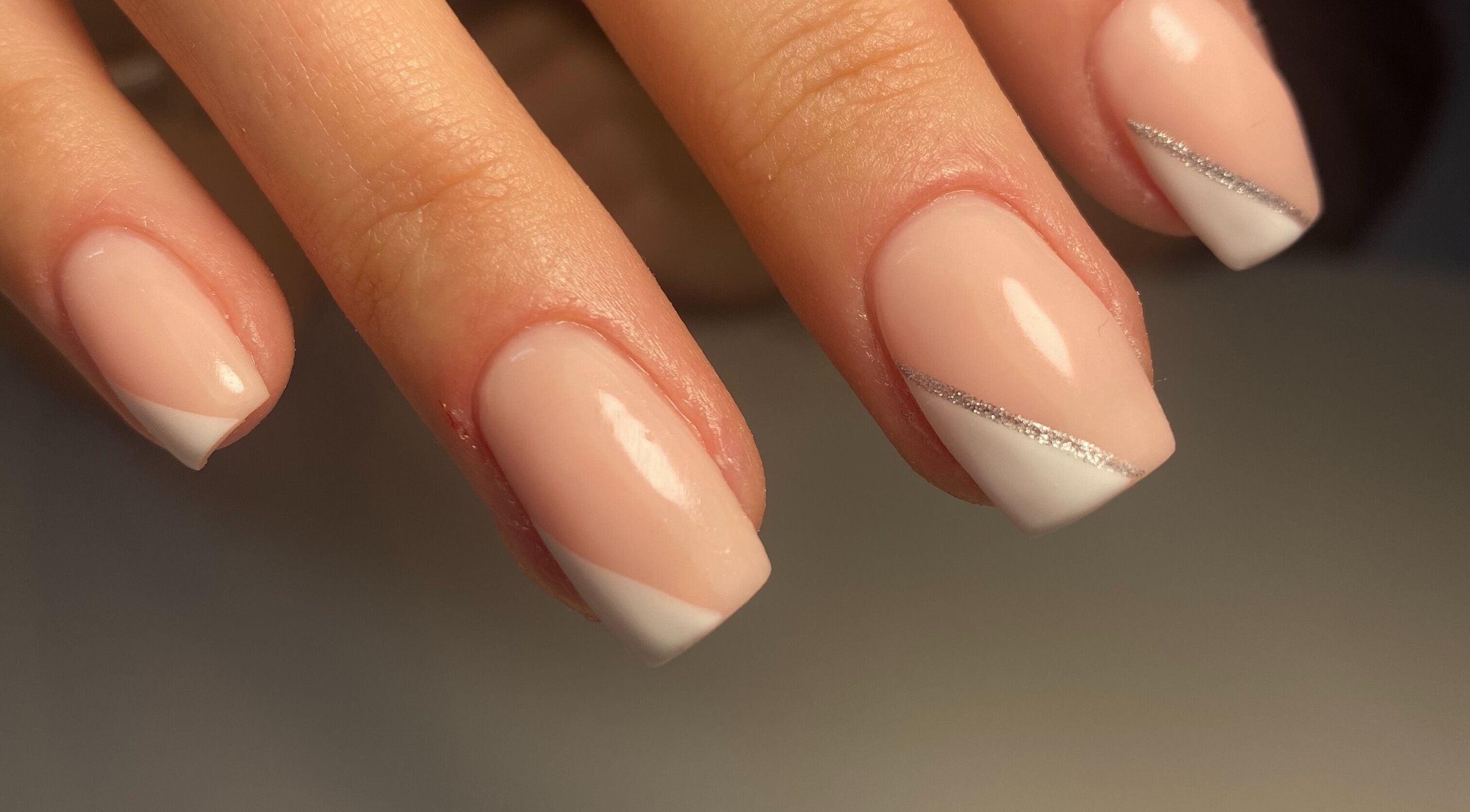 Elegant French manicure with silver accents at Gina Rose Beauty, Sutton Coldfield, England, GB.