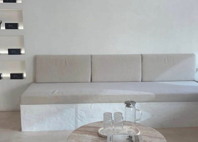 Sleek modern lounge at Blanc Beauty, Surfers Paradise, Queensland, AU with minimalist decor and soft seating.