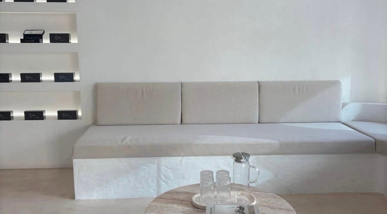 Sleek modern lounge at Blanc Beauty, Surfers Paradise, Queensland, AU with minimalist decor and soft seating.