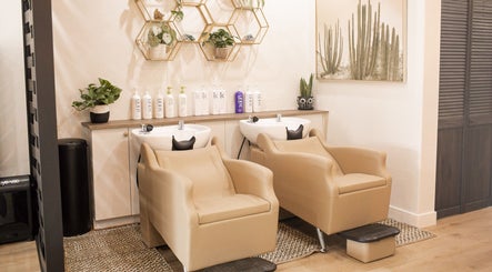 Stylish hair wash stations at The Acacia Salon in San Diego, California, US adorned with modern decor.