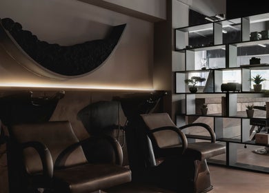 Stylish interior of Anchor Lab, a modern beauty venue in London, England with chic seating and décor.