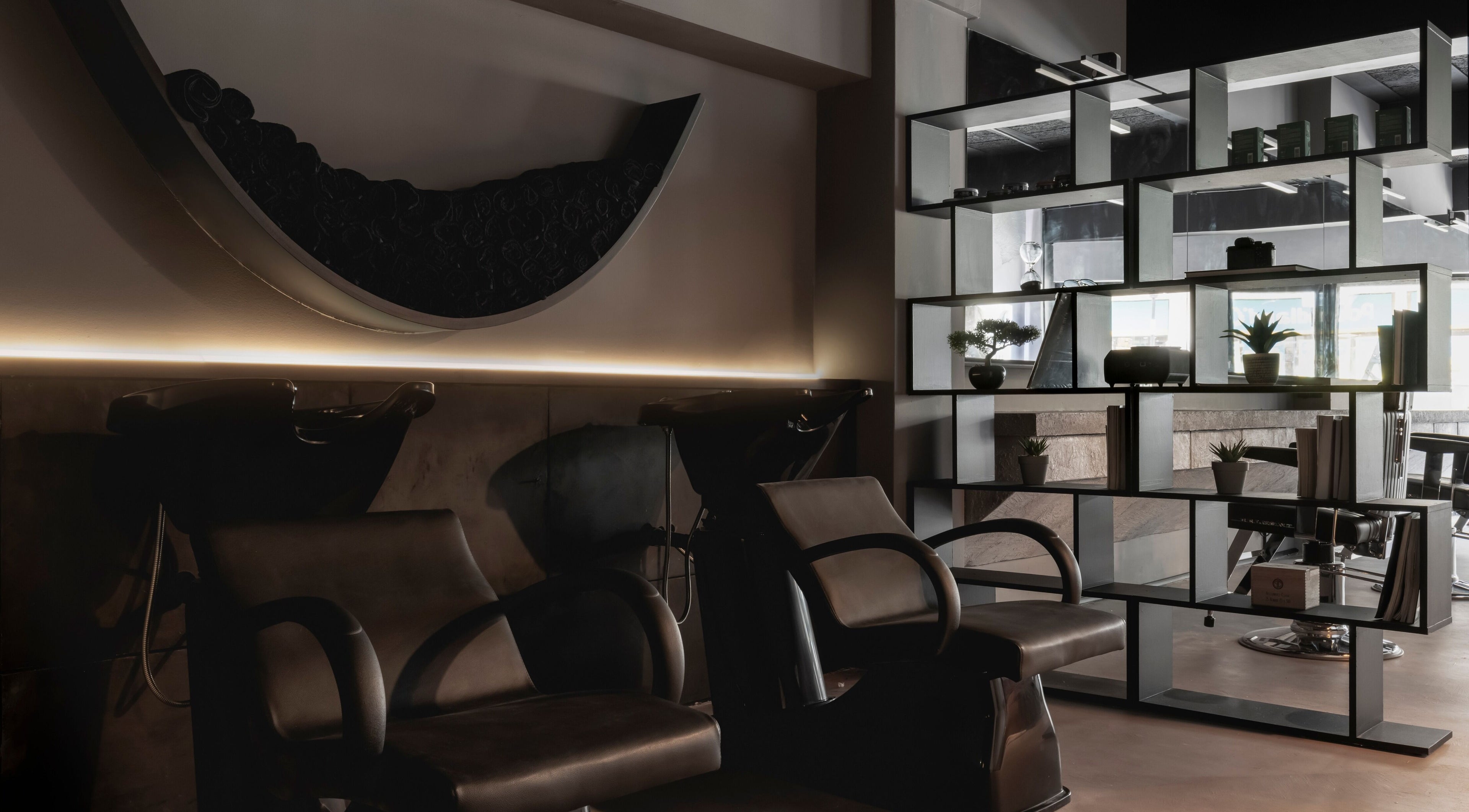 Stylish interior of Anchor Lab, a modern beauty venue in London, England with chic seating and décor.