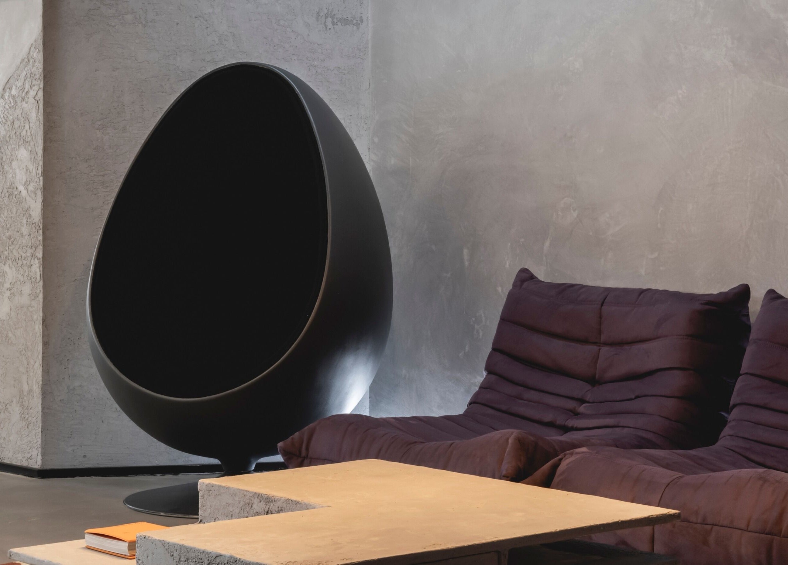 Modern egg chair and plush sofa in Anchor Lab, London, England, GB create a chic and inviting atmosphere.