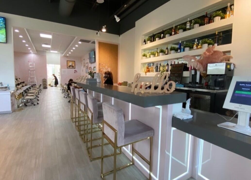 Stylish interior of Selfie Salonbar in Palm Beach Gardens, Florida, US, featuring a modern bar and seating area.