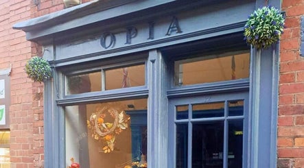 Charming blue facade of Jazz at Opia Hair and Beauty, Leek, England, GB with elegant decor.