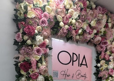Beautiful floral wall display at Jazz at Opia Hair and Beauty in Leek, England, GB.