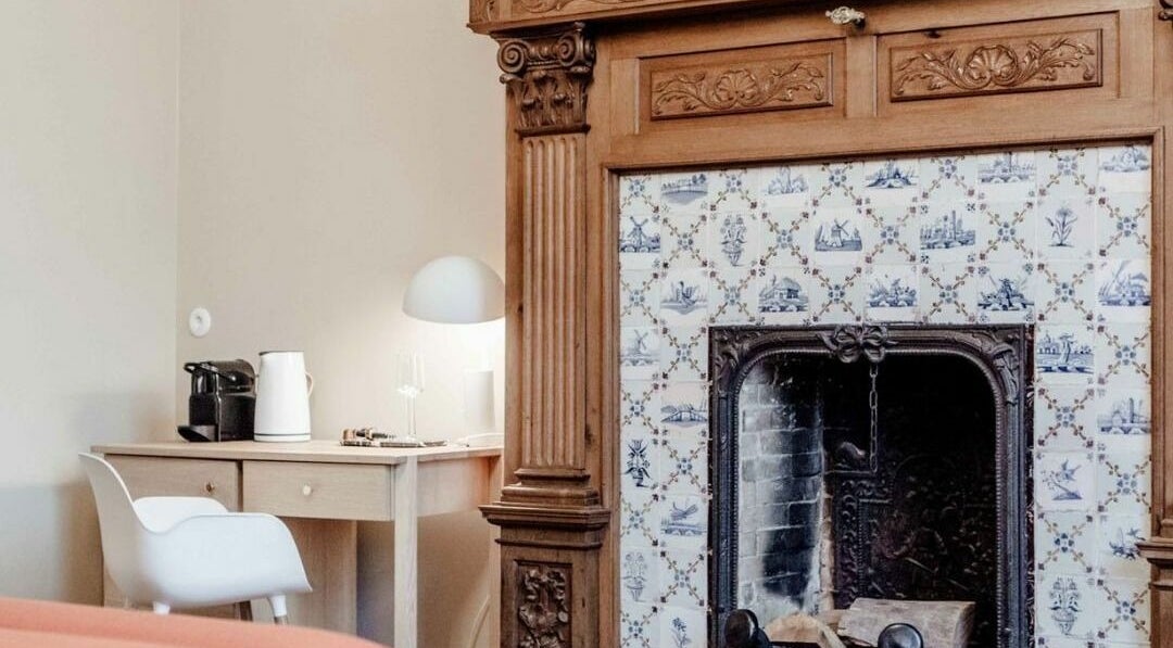 Charming interior with antique fireplace at Sanctum Spa, Maastricht, Limburg, NL.