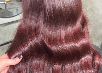Lustrous crimson waves styled at Roux - Jessica, Irlam, England, GB. Perfect shine and color enhancement.