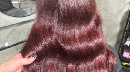 Lustrous crimson waves styled at Roux - Jessica, Irlam, England, GB. Perfect shine and color enhancement.