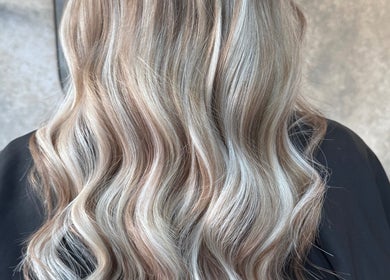 Elegant wavy blonde hair styled at Roux - Jessica, Irlam, England, GB.