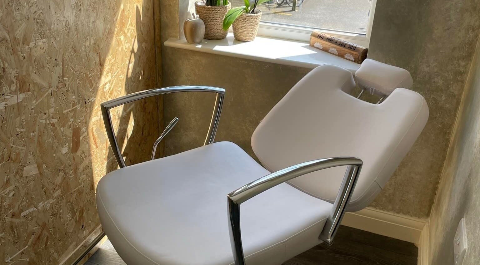 Bright treatment chair by window at Roux - Jessica, Irlam, England, GB.