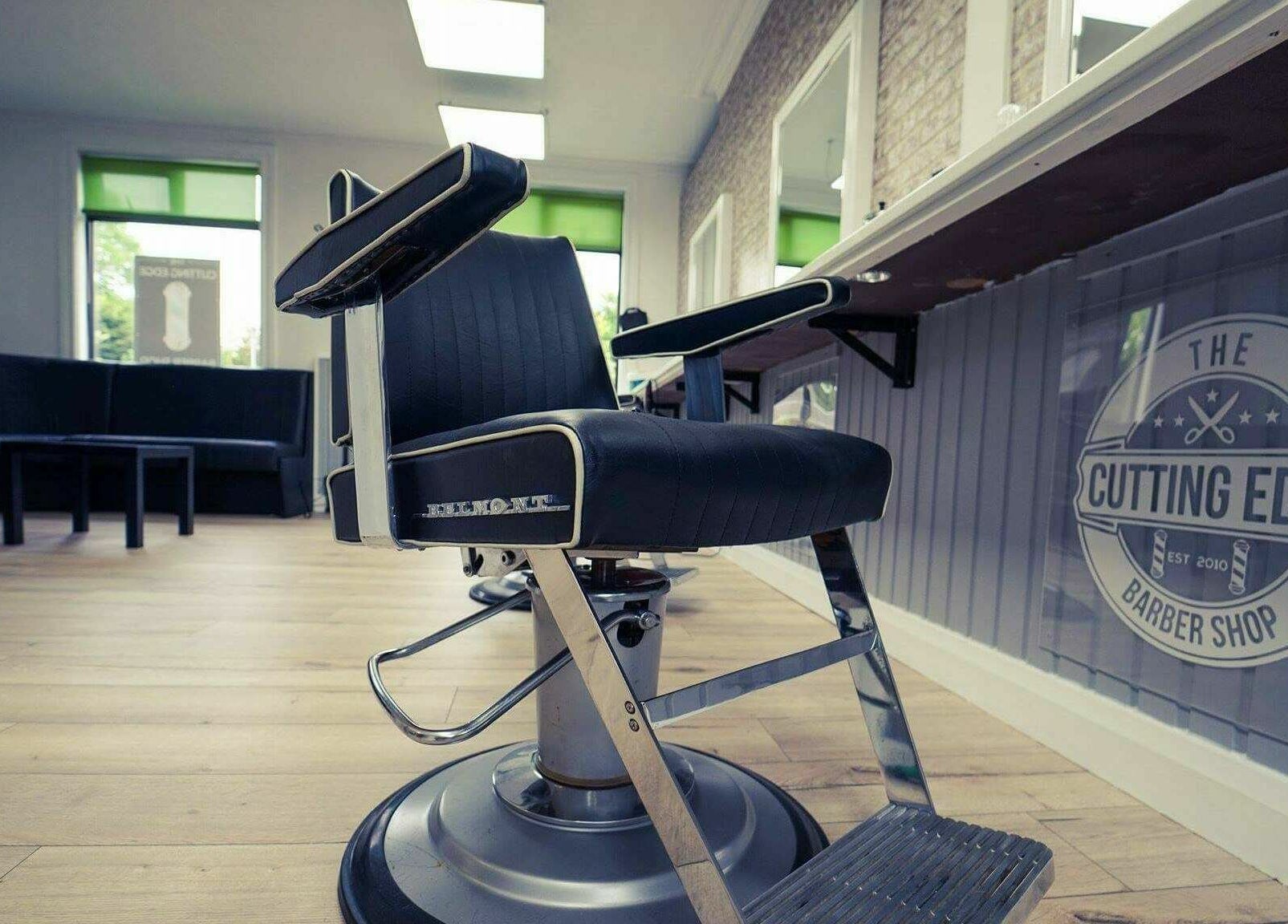 The Cutting Edge Barber Shop interior in Belfast, Northern Ireland, GB, featuring modern barber chair and decor.