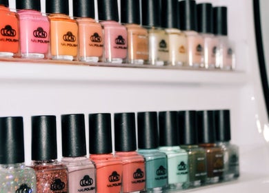 Colorful nail polish display at The Nail Room, Cape Town, Western Cape, ZA showcases vibrant hues.