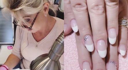 Nail technician at The Nail Room, Cape Town, Western Cape, ZA, crafting elegant French manicure with rhinestones.