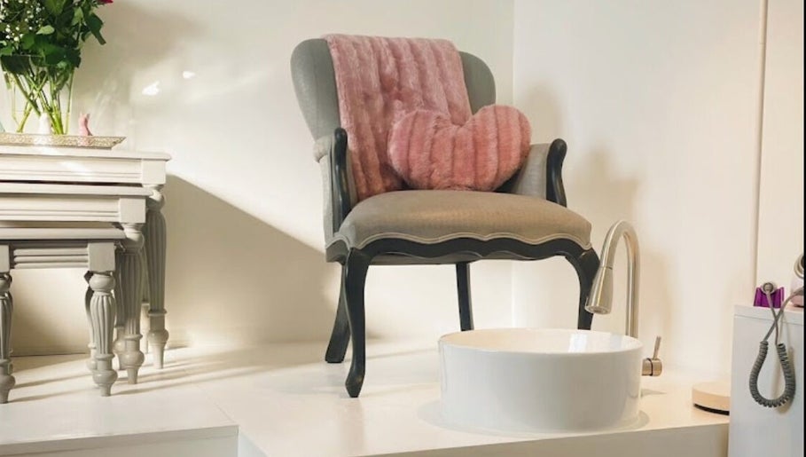 Elegant pedicure chair with pink accents at The Nail Room, Cape Town, Western Cape, ZA.