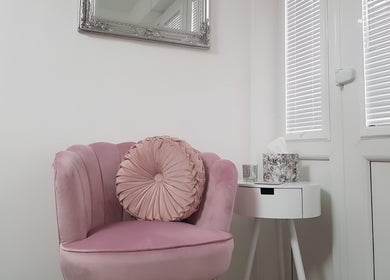 Elegant pink chair in minimalist room at Just Beauty by Zoe, Houghton le Spring, England, GB.