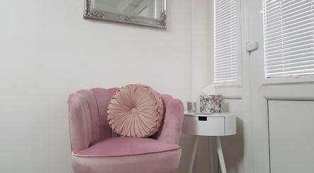Elegant pink chair in minimalist room at Just Beauty by Zoe, Houghton le Spring, England, GB.