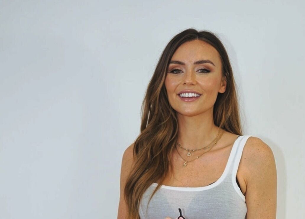 Smiling woman at THE BOUTIQUE by MLR, Barry, Wales, GB, showcasing beauty services.