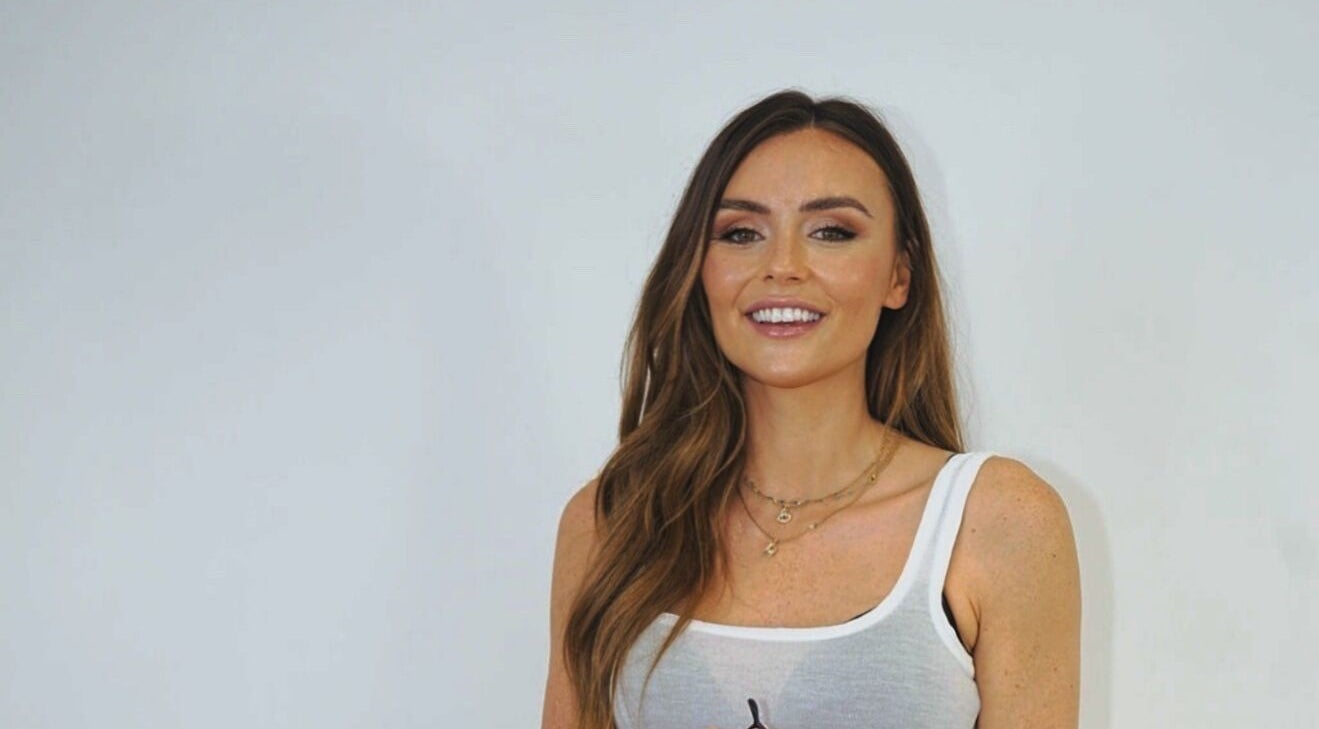 Smiling woman at THE BOUTIQUE by MLR, Barry, Wales, GB, showcasing beauty services.