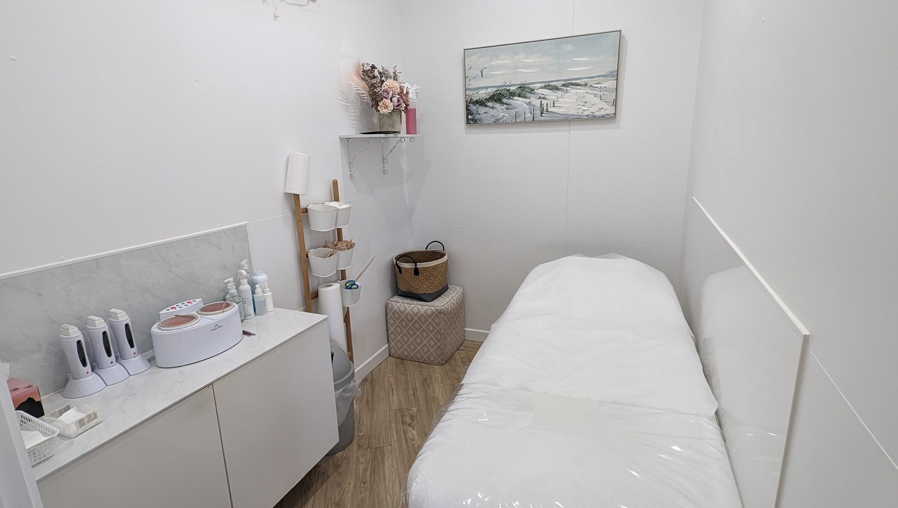 Cozy treatment room at The Waxxx Pot in Maroochydore, Queensland, AU with a bed and modern equipment.