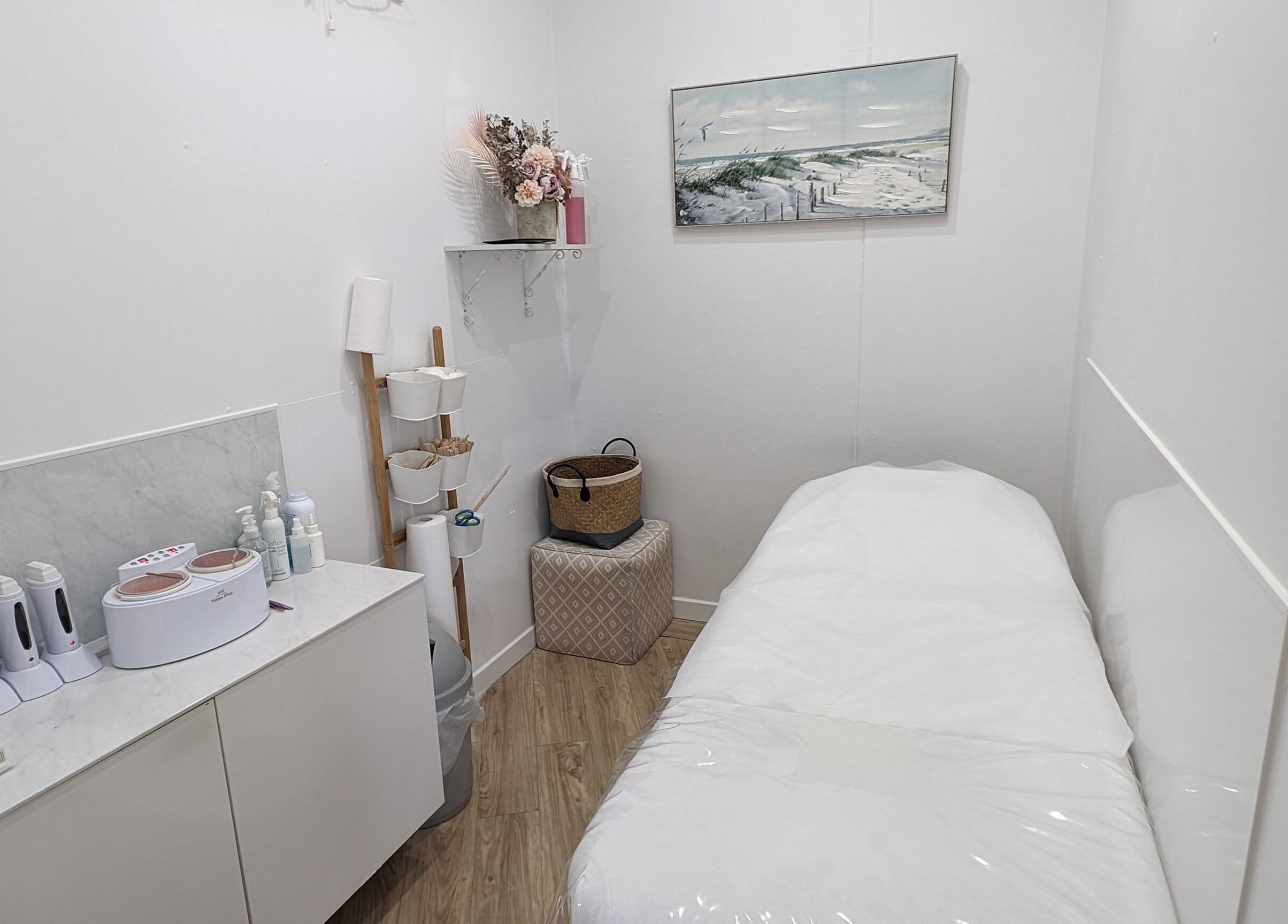 Cozy treatment room at The Waxxx Pot in Maroochydore, Queensland, AU with a bed and modern equipment.