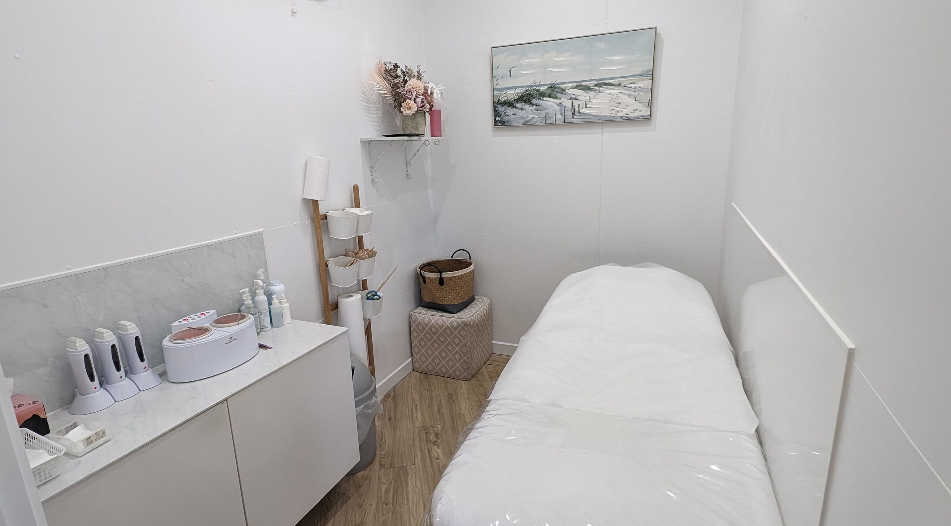 Cozy treatment room at The Waxxx Pot in Maroochydore, Queensland, AU with a bed and modern equipment.