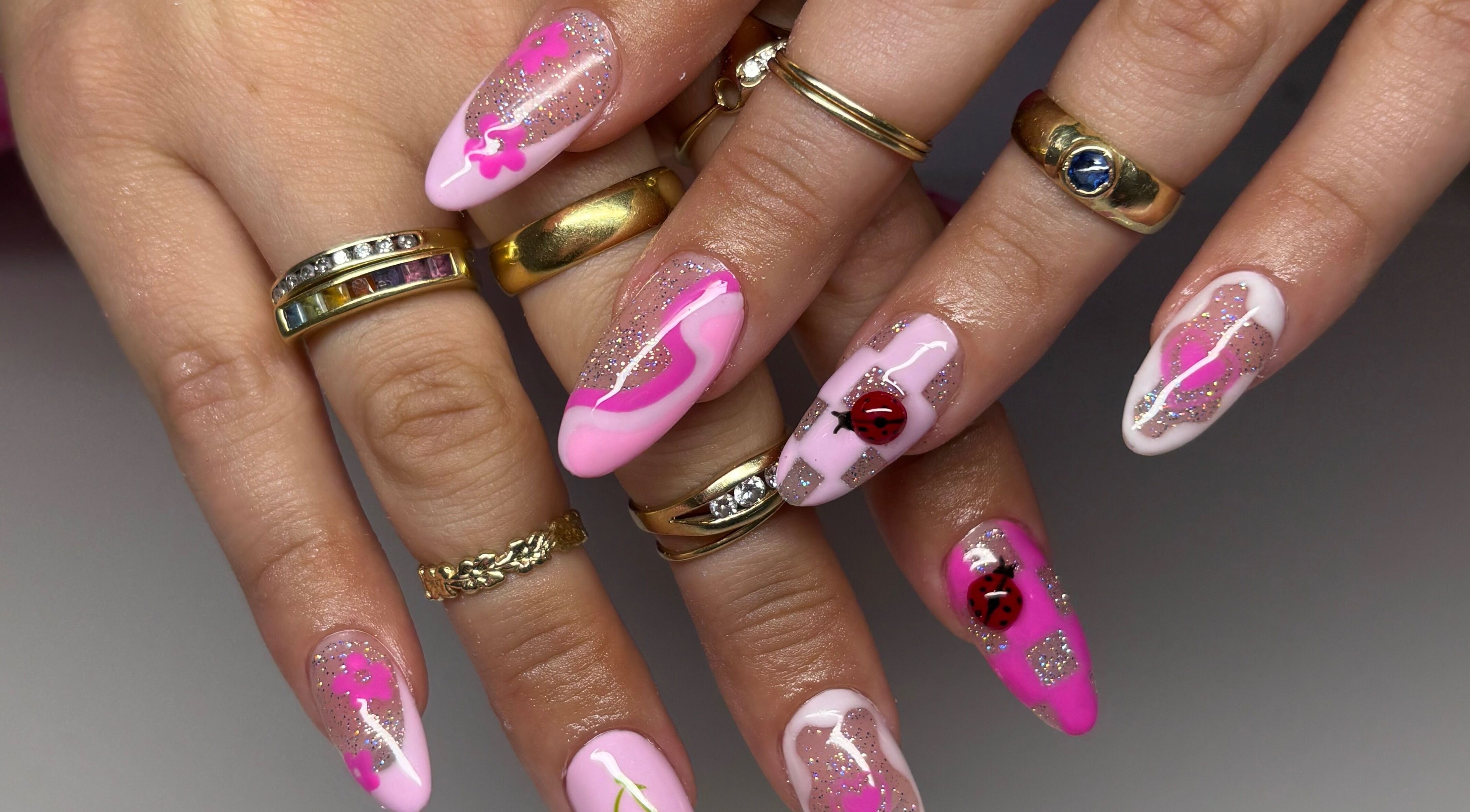 Bright pink artful manicure at Groove Salon, Newtown, New South Wales, AU with sparkling accents.