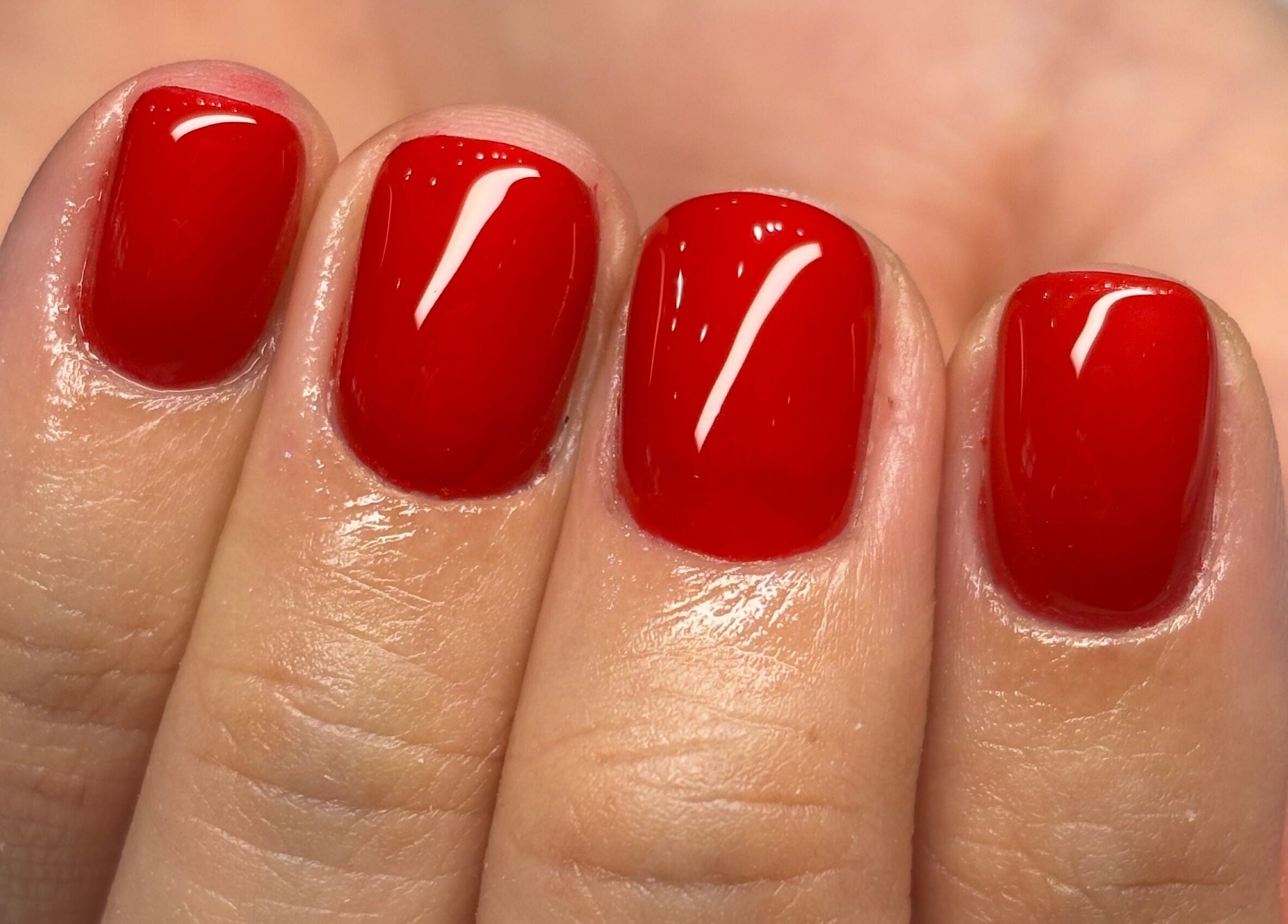 Vibrant red manicure at Groove Salon, Newtown, New South Wales, AU showcasing elegant nail art.