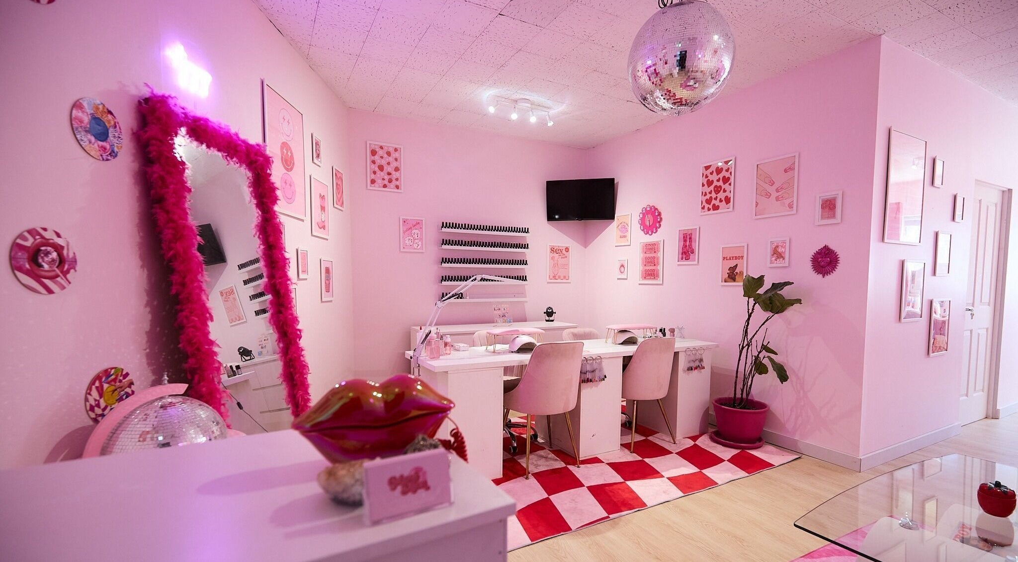 Modern nail salon room at Groove Salon, Newtown, New South Wales, AU with pink decor and elegant furnishings.
