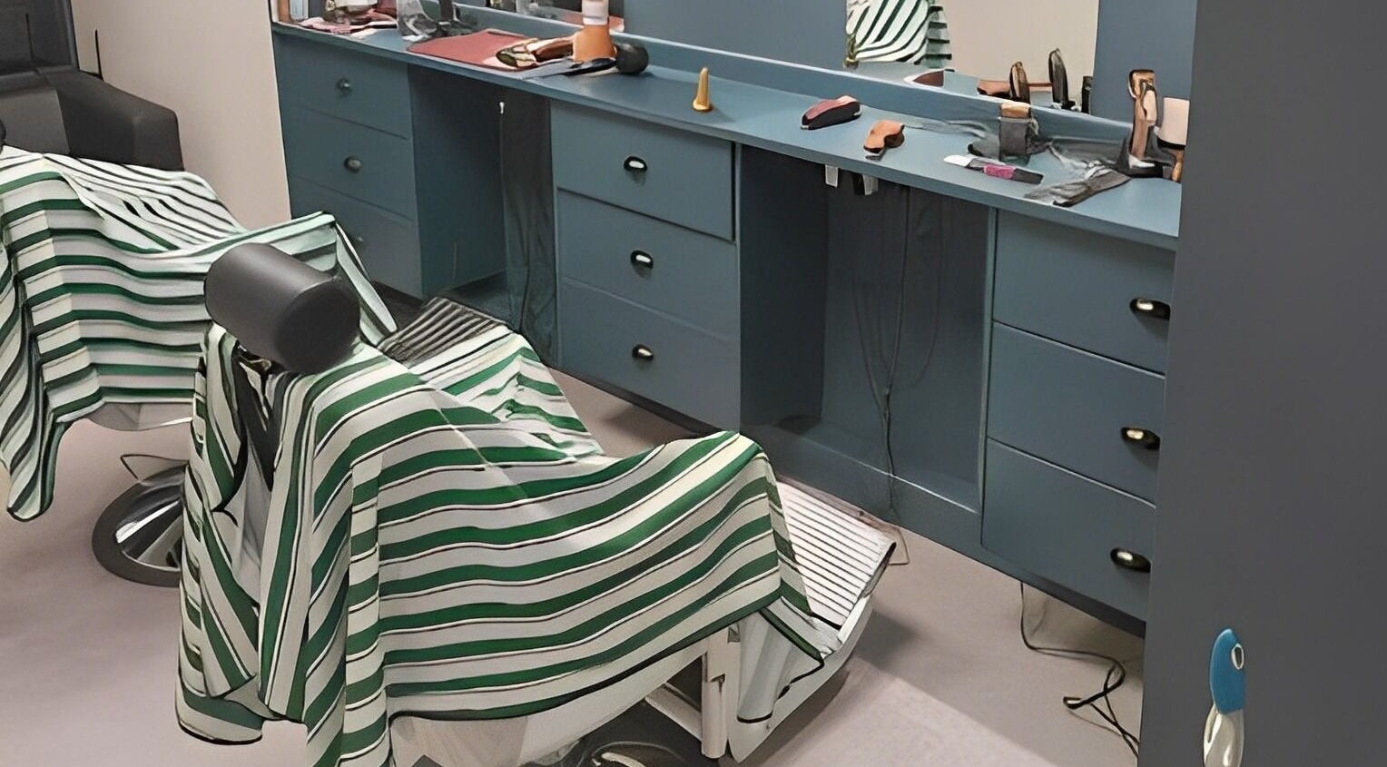 Elegant barber chairs at The Yorkshire Barbers in Birstall, England, GB, showcasing a stylish, modern decor.