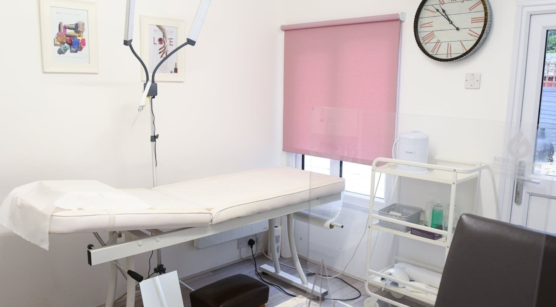Relaxing treatment room at Crescent Brows, Lambourn, England, GB, featuring a comfortable massage table and serene decor.
