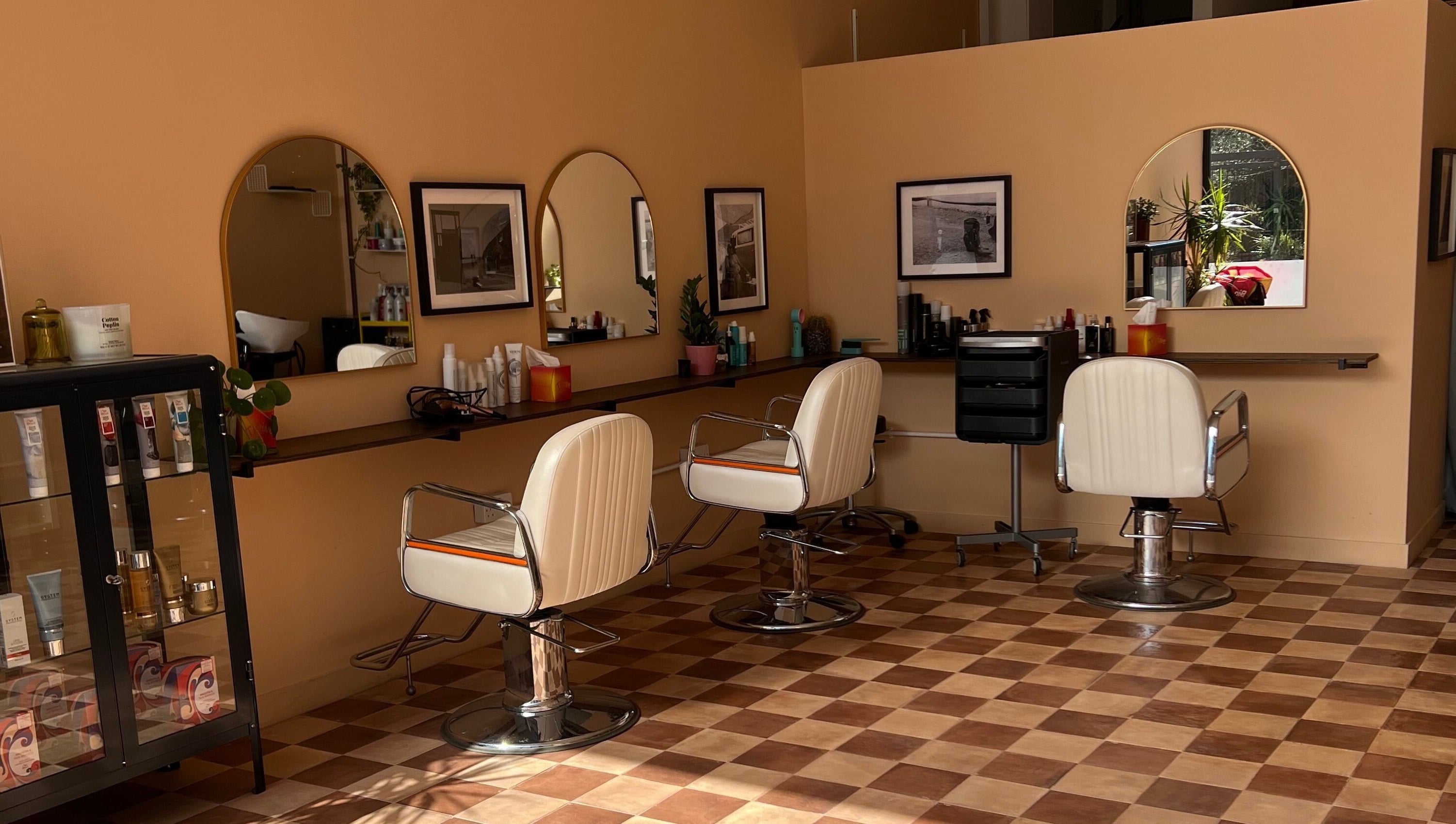 Maxine's stylish salon interior with white chairs and decor in Southend-on-Sea, England, GB.