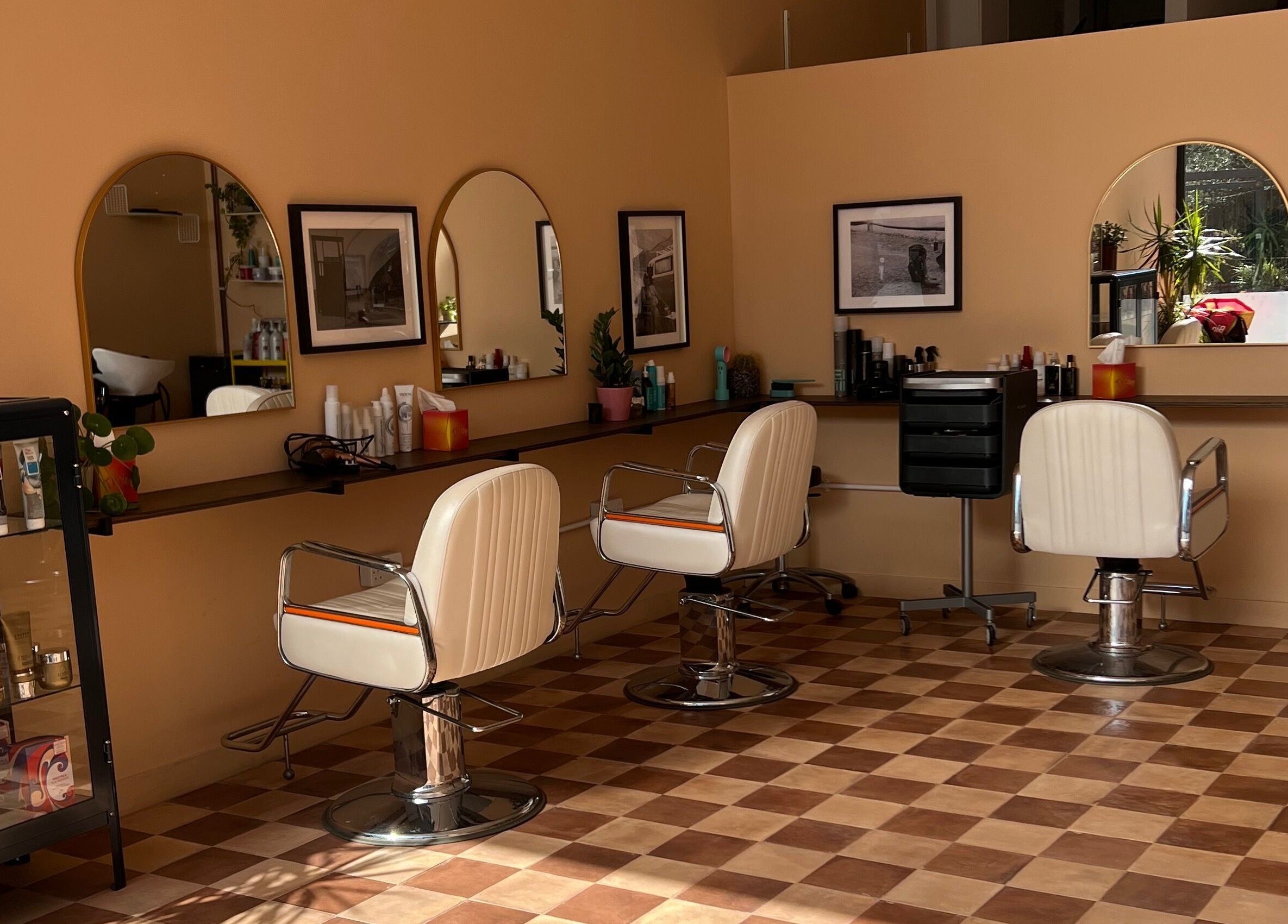 Maxine's stylish salon interior with white chairs and decor in Southend-on-Sea, England, GB.