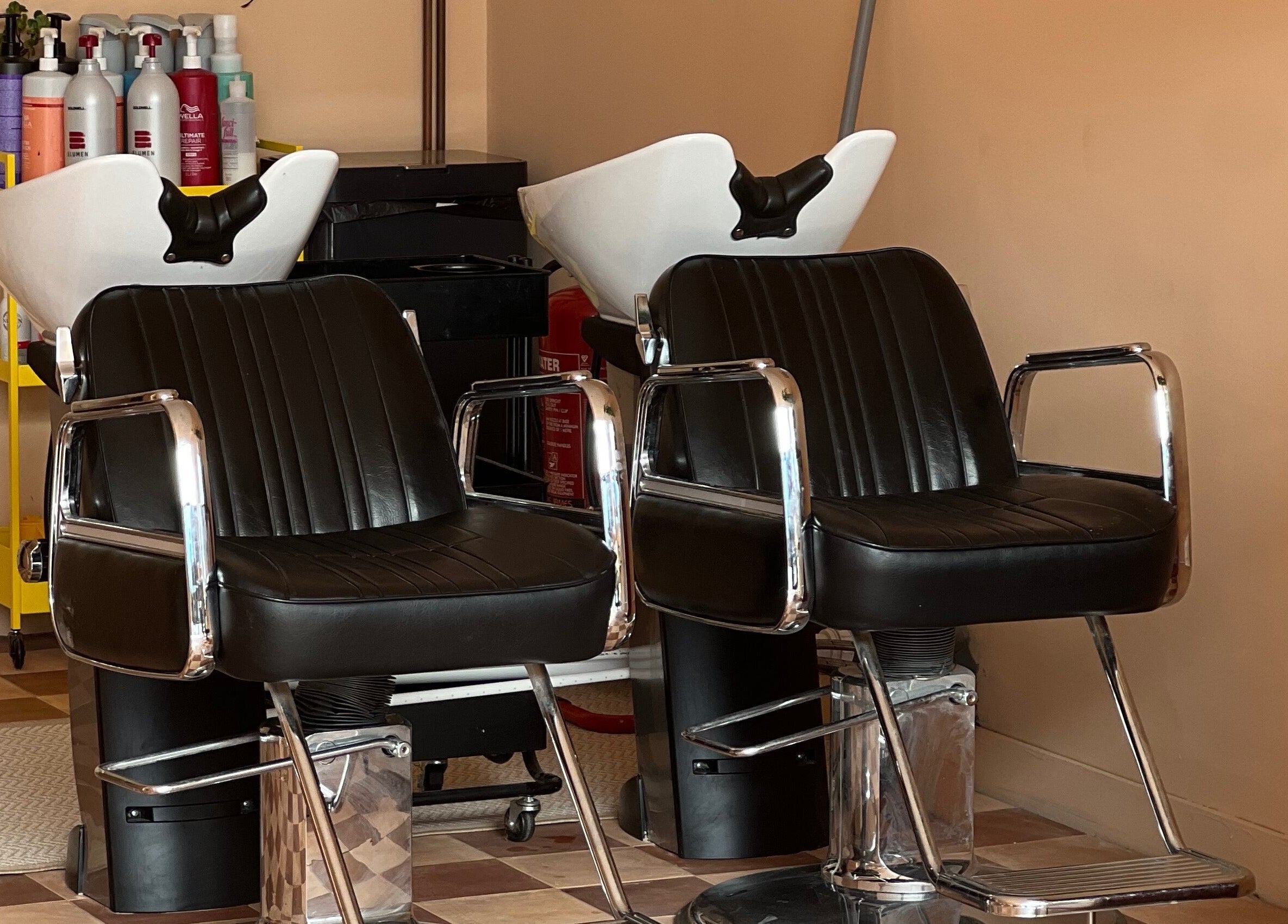Elegant salon chairs at Maxine, Southend-on-Sea, England, GB, enhancing comfort and style.