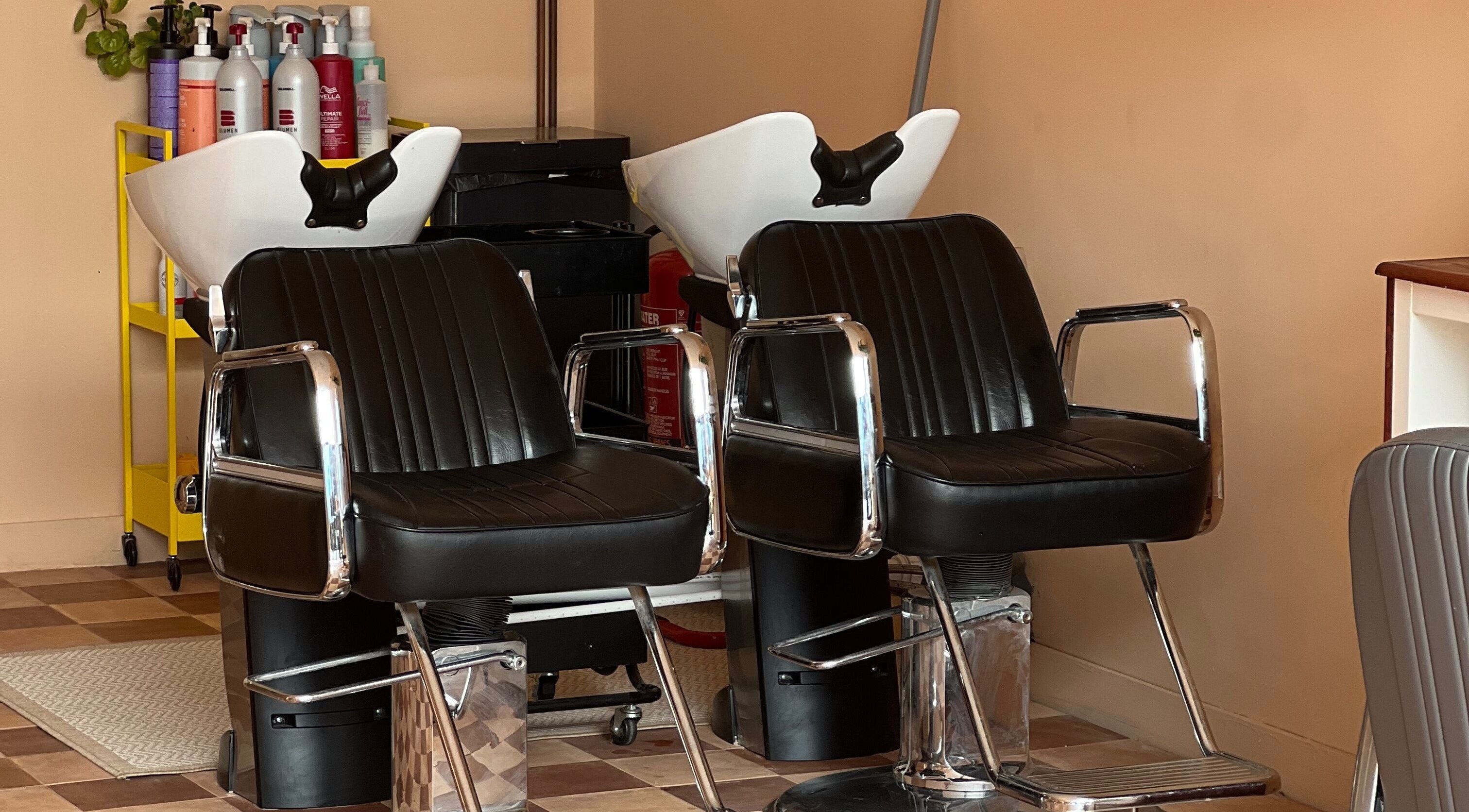 Elegant salon chairs at Maxine, Southend-on-Sea, England, GB, enhancing comfort and style.