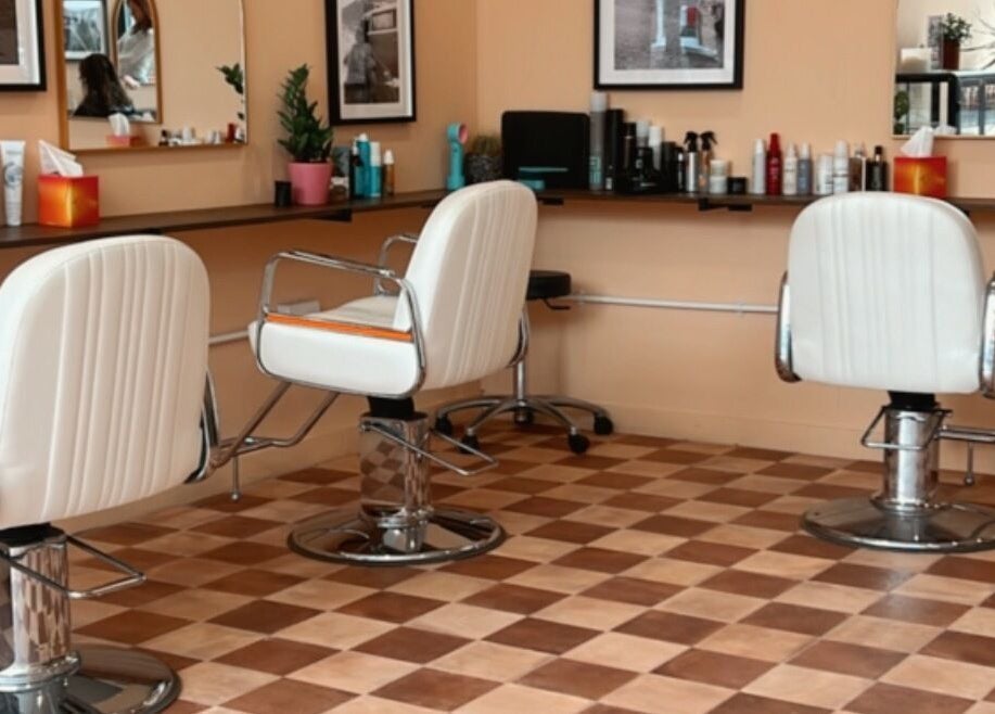 Modern salon chairs at Maxine, Southend-on-Sea, England, GB, offering chic and comfortable styling experience.