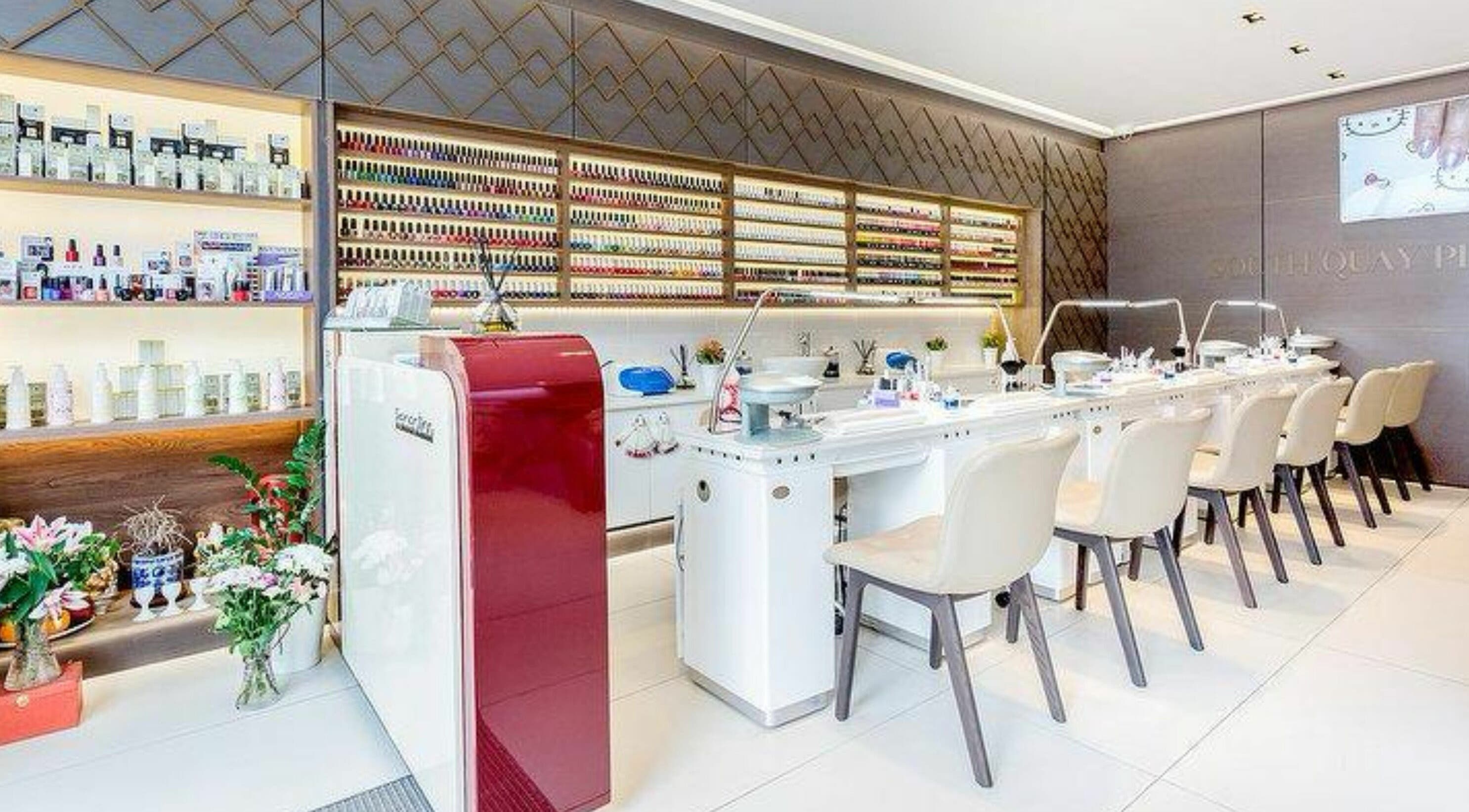 The Nail Spa in London, England, GB showcases a sleek manicure station with vibrant nail polishes.