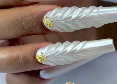 Elegantly sculpted pearl nails with gold detail at Infinity Nails, Windhoek, Khomas Region, NA.