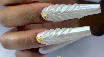 Elegantly sculpted pearl nails with gold detail at Infinity Nails, Windhoek, Khomas Region, NA.