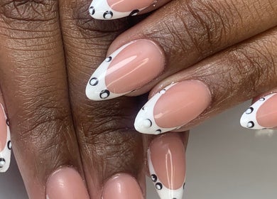 Stylishly designed nails with white and black details at Infinity Nails, Windhoek, Khomas Region, NA.