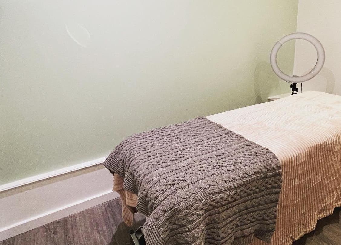 Cozy treatment room at Faith. Hair and Beauty, Chislehurst, England, GB, featuring a comfortable massage bed.