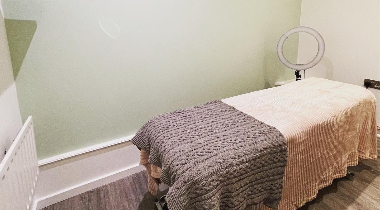 Cozy treatment room at Faith. Hair and Beauty, Chislehurst, England, GB, featuring a comfortable massage bed.