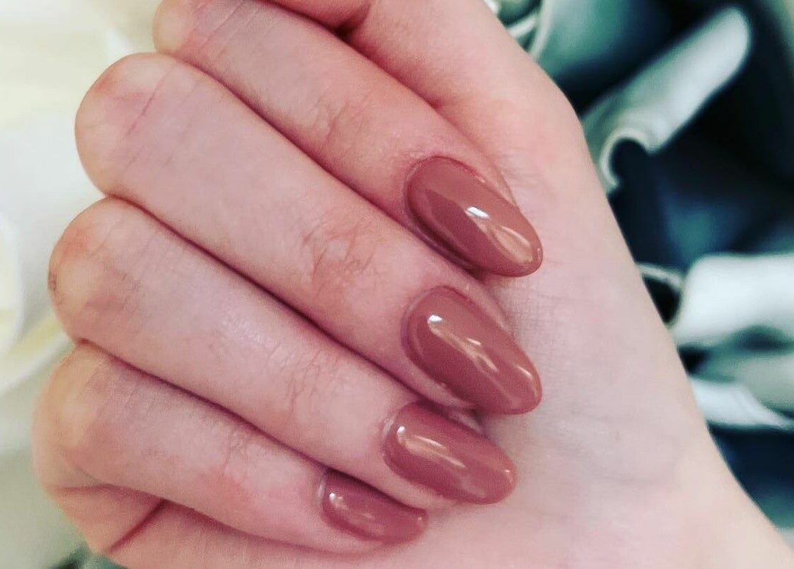 Elegant cocoa nail art at Orange Nail Studio in Beverly, Massachusetts, US, showcasing glossy manicure style.