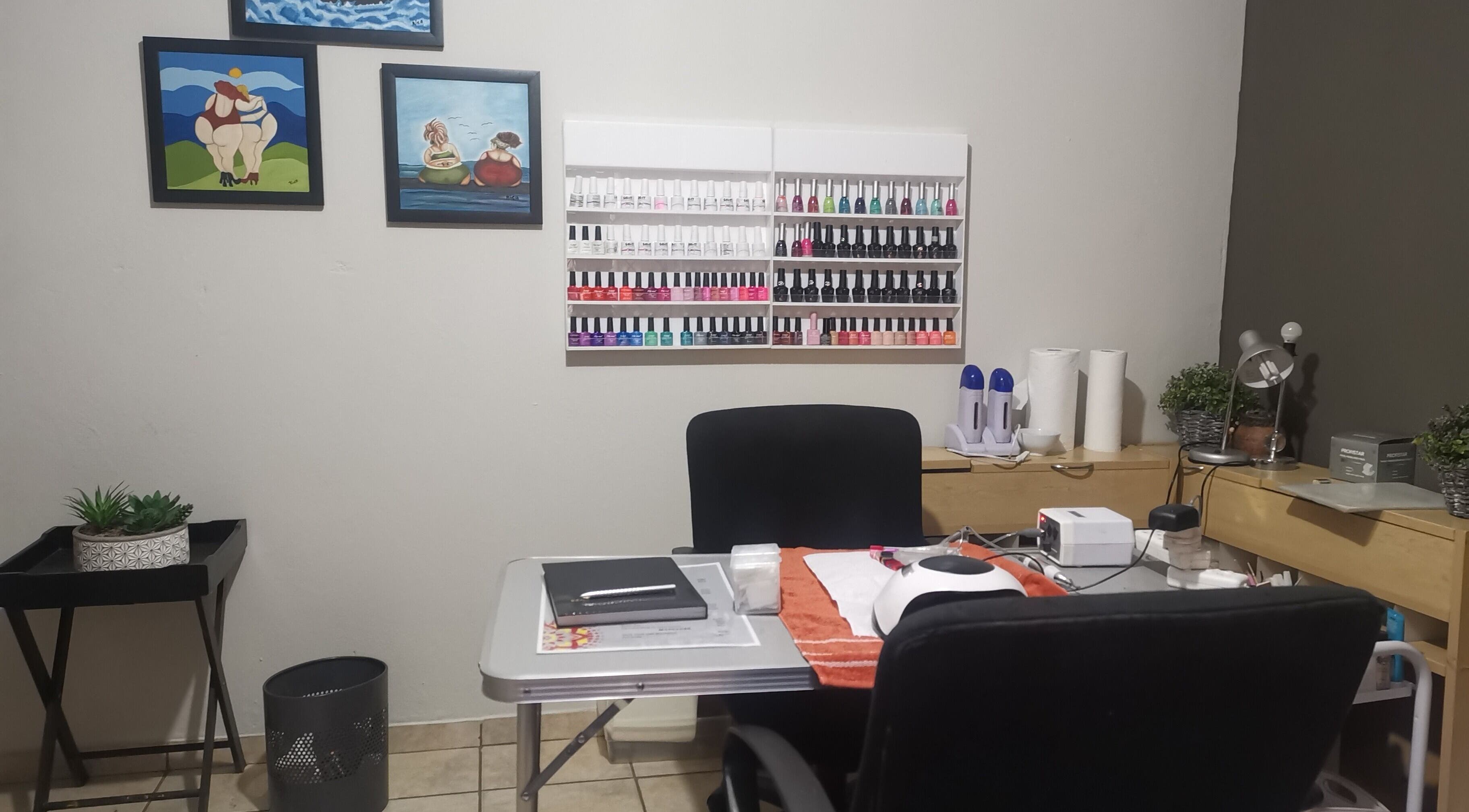 Nail salon setup at Beauticave in Krugersdorp, Gauteng, ZA with polish display and manicure tools.