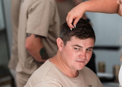 Stylist perfecting a client's look at BW Hair, East Corrimal, New South Wales, AU.